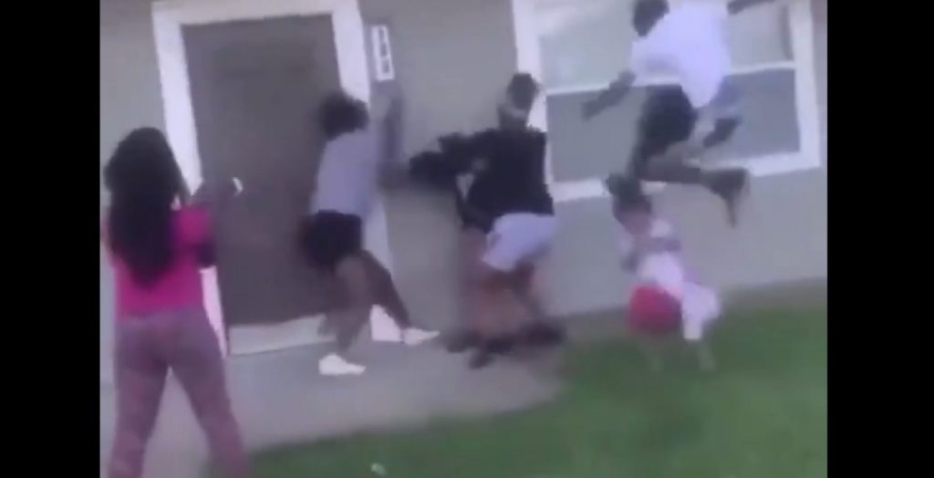 black mob drop-kick little girl head